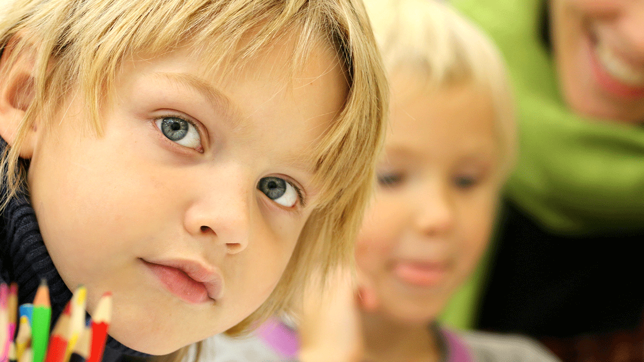 boy in pre-kindergarten classroom setting