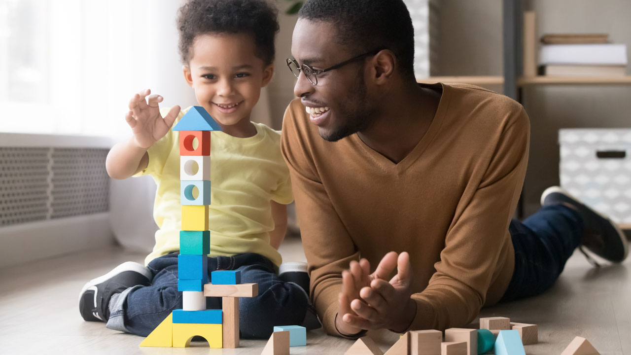 Dad and son playing with blocks