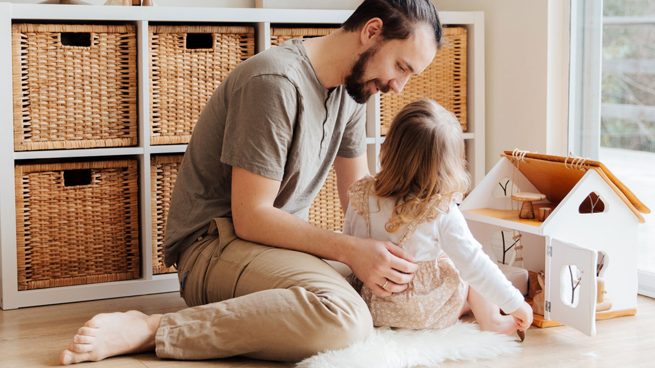 Day playing with toddler and dollhouse