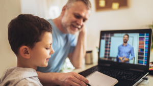 Dad helping son with remote learning